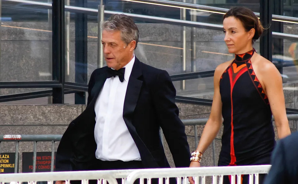 Hugh Grant and wife Anna Eberstein arrive for Taylor Swift and Travis Kelce's July 3 wedding.